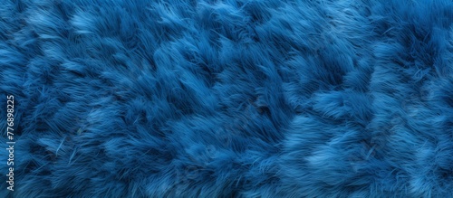 Close-up view of a detailed blue fur texture, showcasing its softness and vibrant color