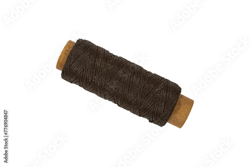 Spool with dark brown threads isolated on transparent background.