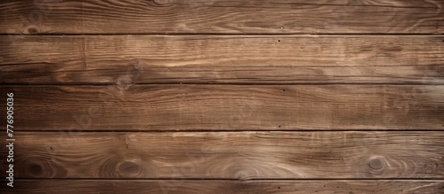 Close-up view of a wooden wall displaying a rich brown stain finish, highlighting the natural textures and patterns of the wood