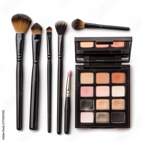 Makeup kit with brushes poised to apply, morning beauty ritual, isolated on white