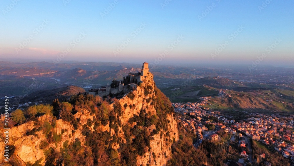 Medieval castle on the cliff overlooking country 