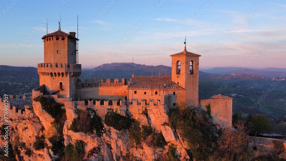 Medieval castle on the cliff overlooking country 