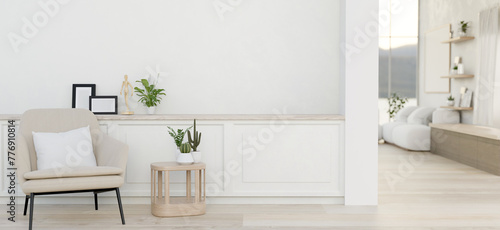 A luxurious minimalist white home corridor features a modern armchair and a mini coffee table. photo