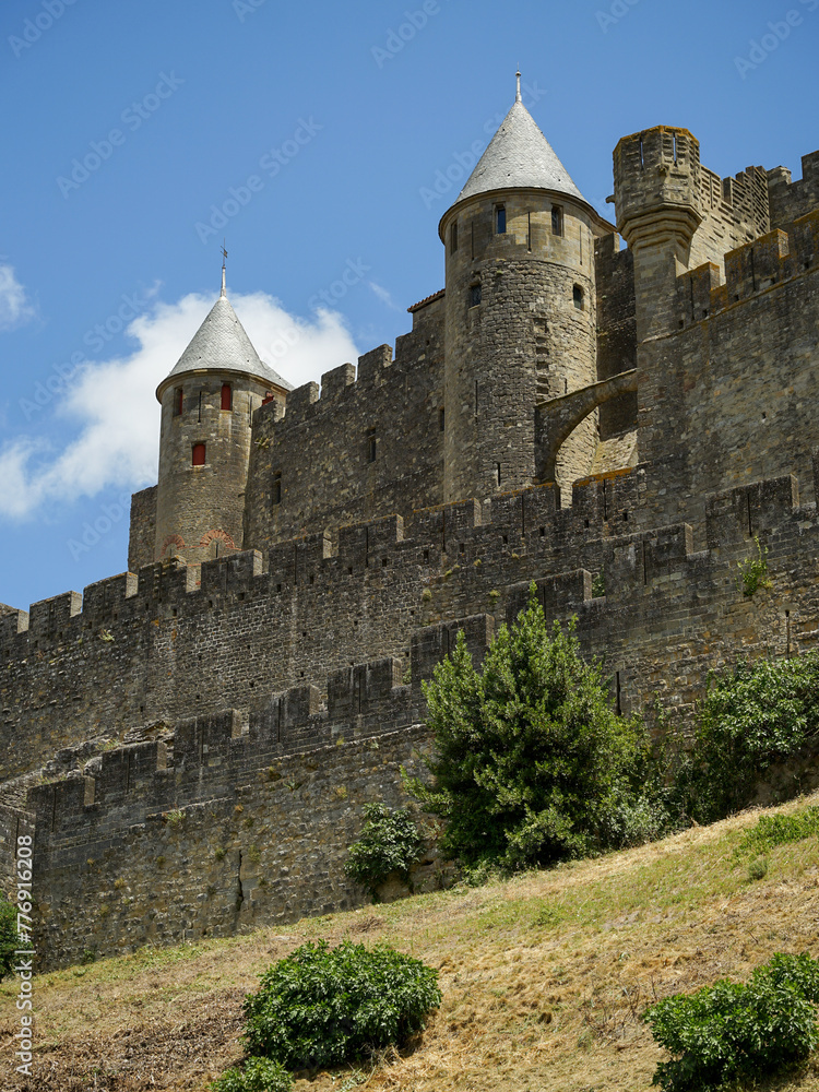 Carcassonne hillltop medieval citadel castle with watchtowers and ramparts close-up view, popular tourist destination, France