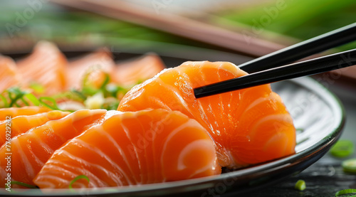 Gourmet Delight: Salmon Sashimi on Elegant Chopsticks