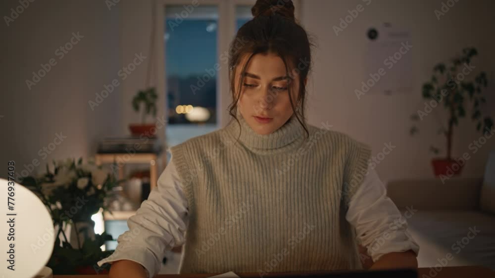 Pensive manager working night at remote workplace closeup. Lady writing notes Pensive manager working night at remote workplace closeup. Lady writing notes