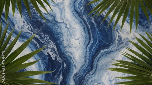 palm leaves on blue-white marble background  tropical foliage with copy space