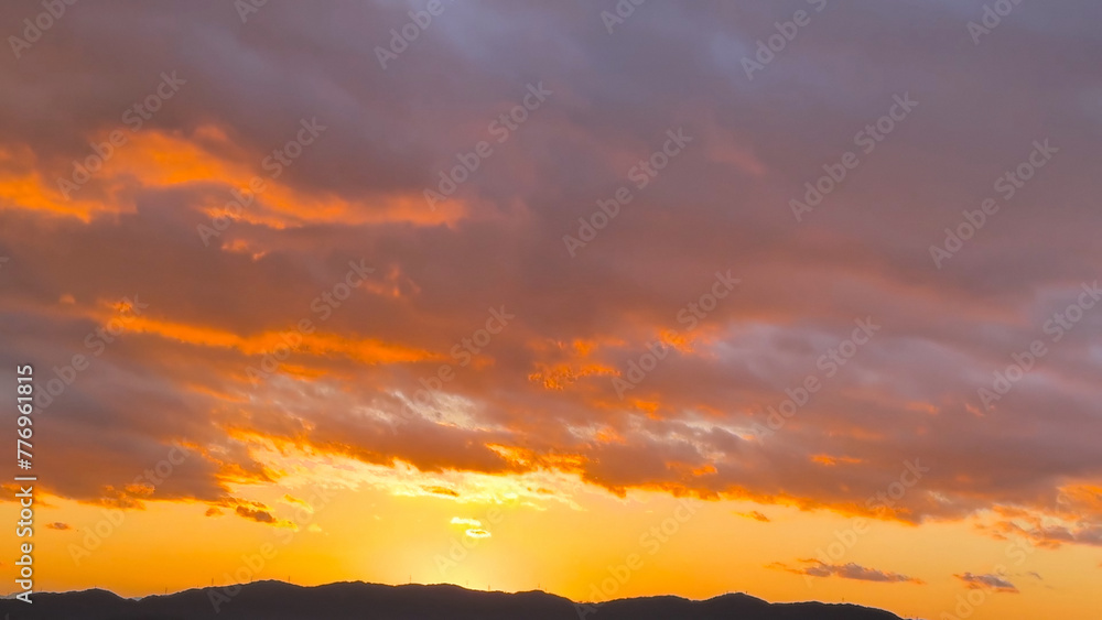 Fototapeta premium Fiery, orange and red colors sunset sky, Kyoto City, Japan, Dec 2023