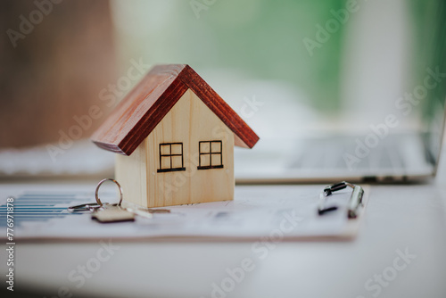 mortgage loan contract Make a contract to buy and sell a house. and home insurance contract Small house design and home purchase contract or mortgage concept.