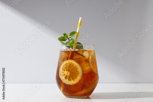A glass of delicious cold tea on a white background