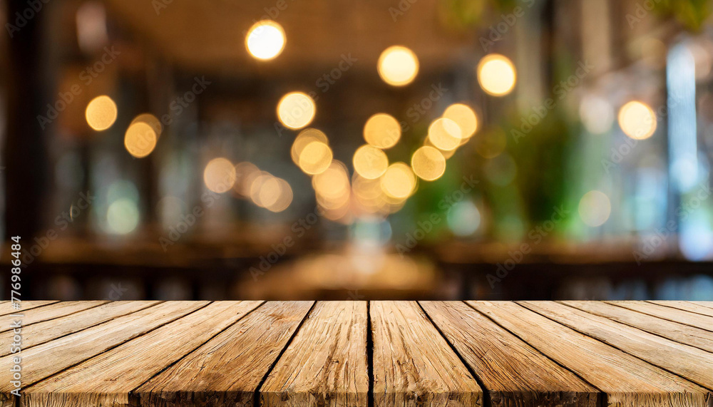 Empty wooden table with bokeh light effect and blur restaurant background, for your photo montage or product display, Space for placing items on the table, product and food display.