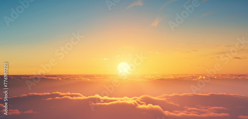 Glorious sunrise over a sea of clouds, with warm golden light. © Jan