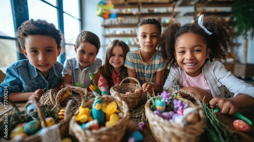 A group of happy children are gathered around a table  smiling and sharing Easter eggs from storage baskets. The toddlers and babies are having fun at this leisure event  building memories together