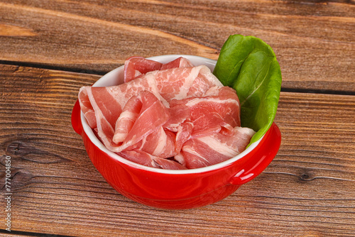 Sliced pork bacon in the bowl