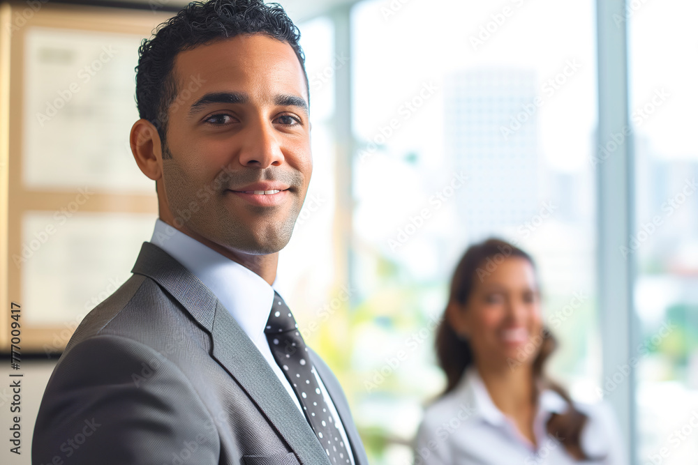 Smiling business man and woman of different races indoors Smiling business man and woman of different races indoors