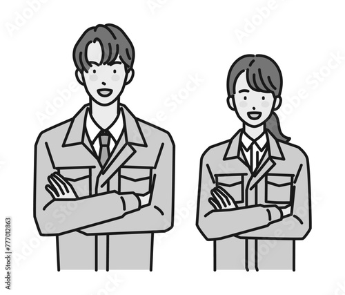 腕組みをする作業服姿の男性と女性（上半身）

