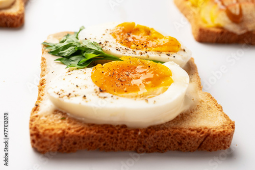 Toasts with boiled eggs and herbs, healthy eating