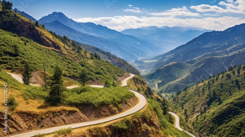 A winding road in the mountains with a scenic view of the landscape