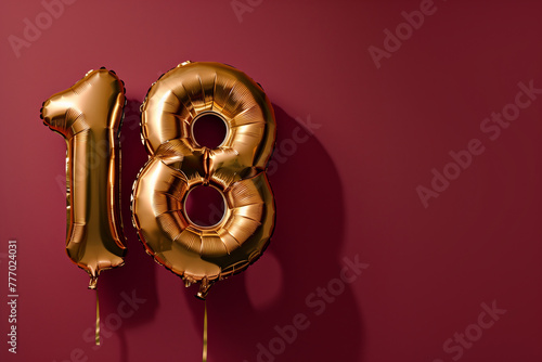 Golden “18” balloons against a burgundy backdrop symbolize the joyous transition into adulthood with celebration