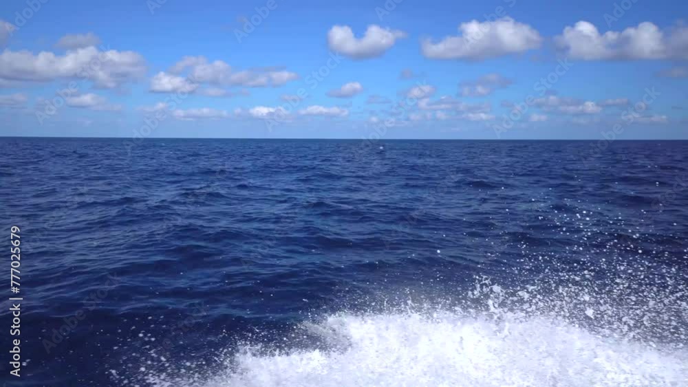 Moving fishing motor boat at the sea. Large fishing ship equipped with nets and a trawler sails through the azure water Sunset rays on water from luxury sail yacht during regatta in ocean Moving fishing motor boat at the sea. Large fishing ship equipped with nets and a trawler sails through the azure water Sunset rays on water from luxury sail yacht during regatta in ocean