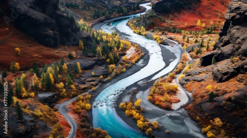 A colorful canyon with a meandering river and a blue sky © stocksbyrs