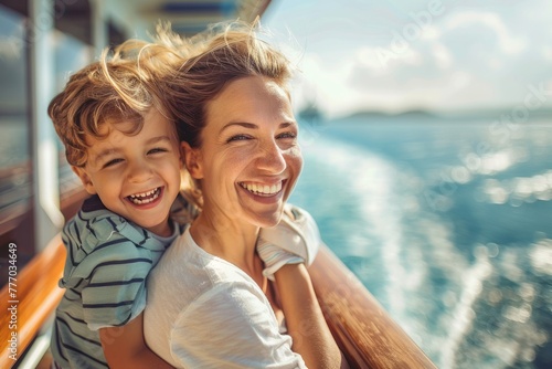 A boy and his mother stand on the deck of the ship and look at the sea.