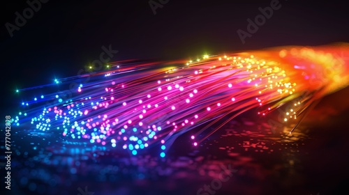 A colorful  glowing  and abstract image of a wire with many small dots. Concept of energy and excitement  as if it is a representation of a high-speed internet connection or a futuristic technology