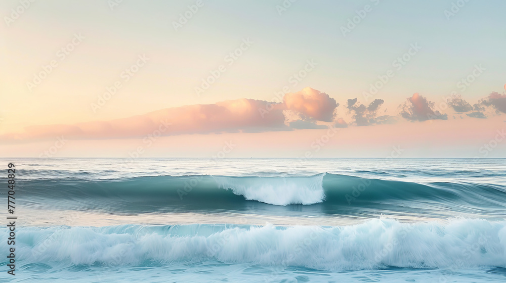 Tranquility and simplicity define this scene of gentle waves under a sky with soft golden hour hues reflecting off the water