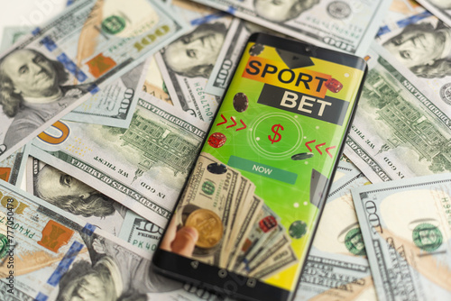 betting on sports, smart phone with working online betting mobile application © Angelov