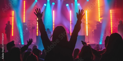 People at a concert waving ...