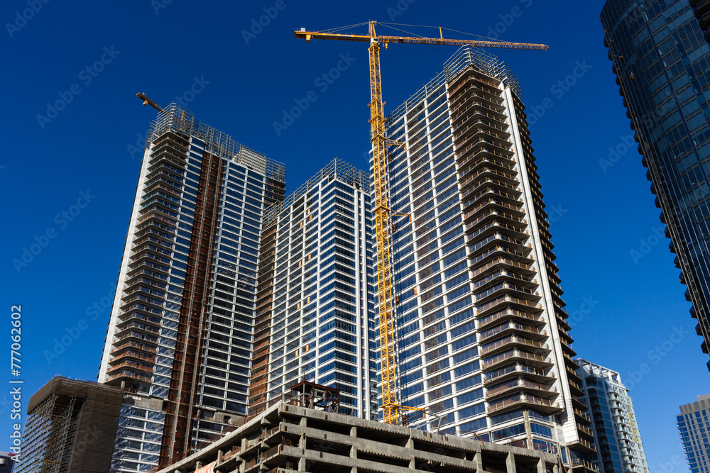 Los Angeles, California, USA, June 20, 2022: Oceanwide Plaza, a residential and retail complex under construction in front of crypto.com Arena in Downtown Los Angeles.