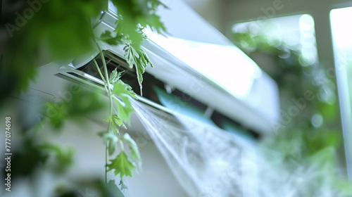 air conditioner closeup with plants photo