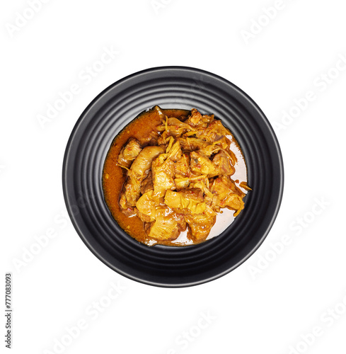 Delicious beef or pork stew in a rustic black plate. Seasoned with fresh coriander, red chilies, garlic, onions and spices. cutting path © WIROT