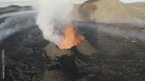 Aerial video of a volcanic eruption, lava and rivers, Litli Harut, Iceland photo