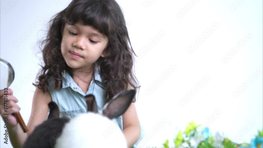 Smiling little girl and with their beloved fluffy rabbit, showcasing the beauty of friendship between humans and animals Smiling little girl and with their beloved fluffy rabbit, showcasing the beauty of friendship between humans and animals