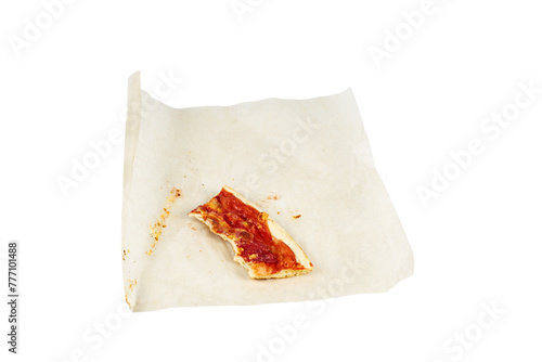 Leftover Piece of Pizza on the paper isolated on a white background