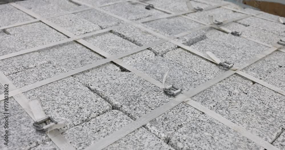 Folded gray paving slabs tied with screed in store closeup 4k movie ...