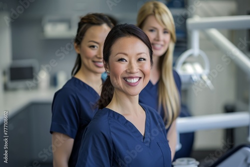 A group of professional women in scrubs standing next to each other, showcasing confidence and teamwork © Ilia Nesolenyi