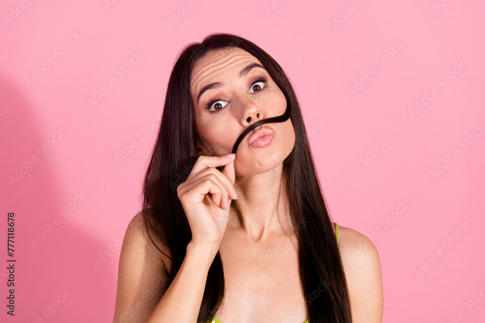 Photo of lovely adorable gorgeous girl wear trendy clothes playing with curl isolated on pink color background Photo of lovely adorable gorgeous girl wear trendy clothes playing with curl isolated on pink color background