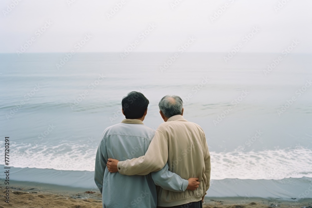 Fototapeta premium Senior father hugging son, have a happy feeling together. Happy active senior couple having fun outdoors. Generative AI.