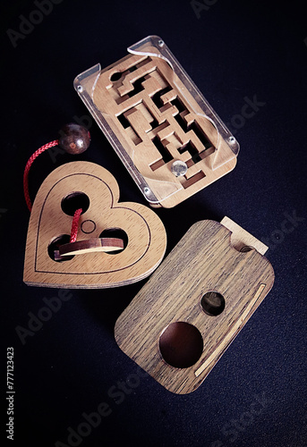 Bilde på lerret Entertaining toys and games with skill: wooden brain teaser puzzles
