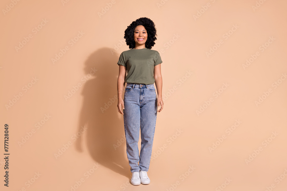 Photo portrait of pretty young woman posing shopping banner dressed trendy khaki outfit isolated on beige color background Photo portrait of pretty young woman posing shopping banner dressed trendy khaki outfit isolated on beige color background