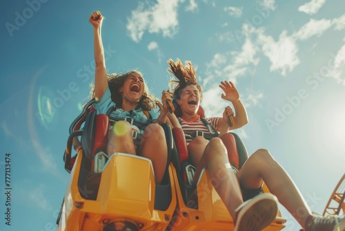 Exhilarating Roller Coaster Ride, Screaming with Joy Against Blue Sky © Ilia Nesolenyi