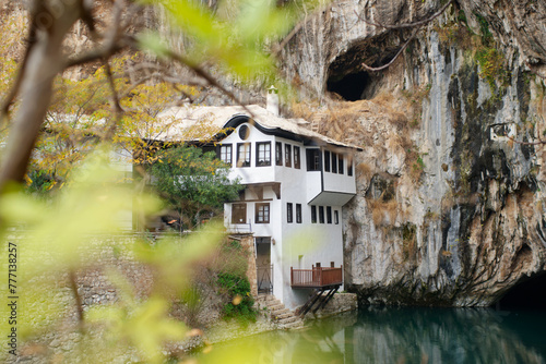 View of Tekija in Blagaj in Bosnia and Herzegovina. The Tekija, dervish house, set at the source of the river Buna. photo