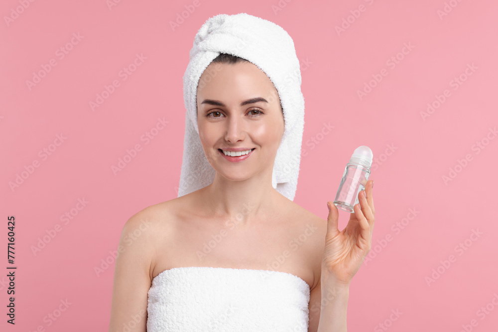 Beautiful woman with deodorant on pink background Beautiful woman with deodorant on pink background
