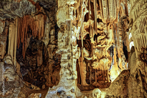 Sculpture like stalactite and stalagmite column in the large underground limestone Cango Caves near Oudtshoorn, Western Cape South Africa