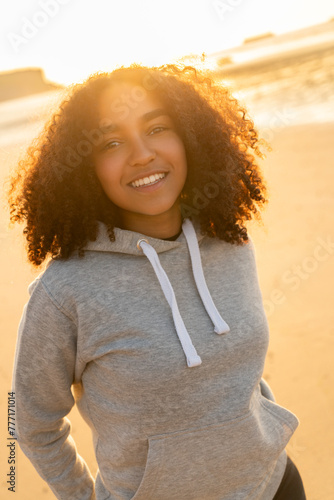 African American Girl Teenager Smiling on a Beach at Sunset