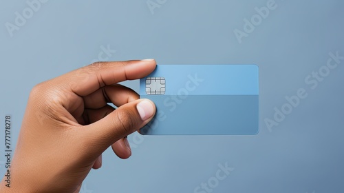 hand holding credit card gray background