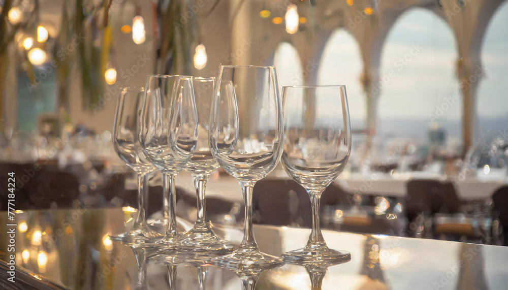 a close up of a plate of food on a table with a wine glass and wine bottle in the background. a close up of a plate of food on a table with a wine glass and wine bottle in the background.