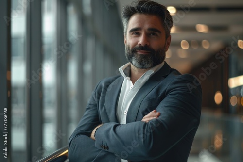 Businessman Portrait. Confident businessman standing arms crossed  smiling.  businessman © darshika